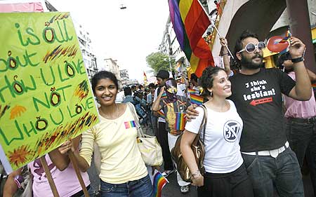 Participants hold placards during a parade for gays and lesbian rights in Mumbai