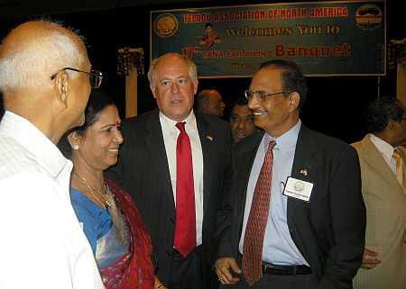 Quinn and TANA President Prakash Chaudhury Kakarala interact with delegates