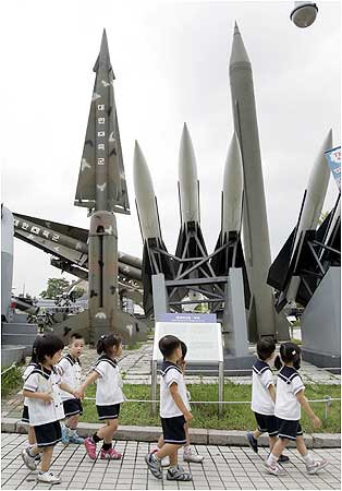 Pupils walk past models of a North Korean Scud-B missile and South Korean missiles at the Korean War Memorial Museum in Seoul.