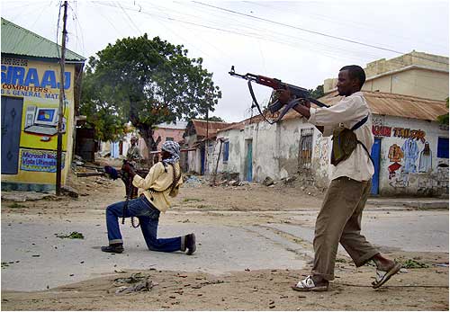 Fighters loyal to Hisbul Islam party take part in a street fight against Somali government forces.