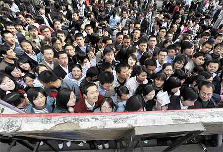 Graduates crowd outside a job fair held in Lanzhou in Gansu province