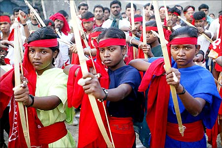 Women Naxalite cadre with bows and arrows during a rally in Kolkata
