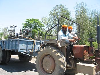 A farmer taking a transformer from Amritsar to his village