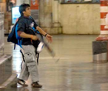 Pakistani terrorist Ajmal Kasab firing at people at Mumbai's Chhatrapati Shivaji Terminus