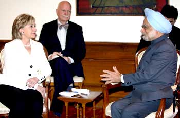 Prime Minister Manmohan Singh with US Secretary of State Hillary Clinton and US Charge d'Affaires in India Peter Burleigh during their meeting in New Delhi