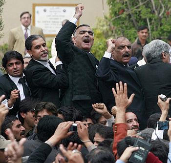 Lawyers and political activists yell jubilant slogans