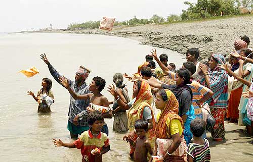 Villagers in Khulna wait for the food packets