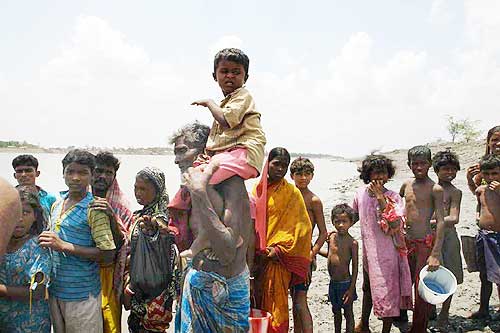 Villagers queue up for drinking water at Sarbaria in Sunderbans