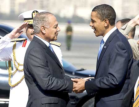 US President Barack Obama is greeted by Egypt's Foreign Minister Ahmad Aboul Gheit after arriving in Cairo