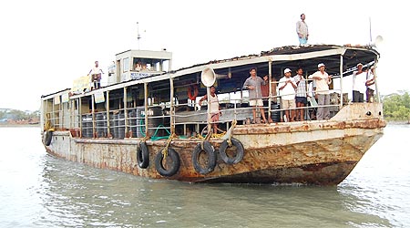 A boat carrying food, water and medicines on its way to the Sunderbans