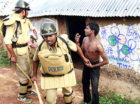 Police arrest a villager suspected to be a Maoist rebel