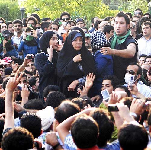 Faezeh Rafsanjani (C), daughter of former Iranian president Akbar Hashemi Rafsanjani, attends an opposition rally