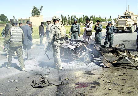 Security personnel at the scene of a suicide blast, Ghazni city, Pakistan, June 23, 2009.