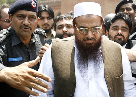 Police escort Lashkar-e-Taiba founder Hafiz Saeed, in Lahore, May 5, 2009.
