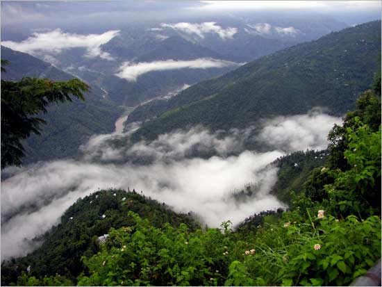 Monsoon clouds descending on green mountains of Kalimpong.