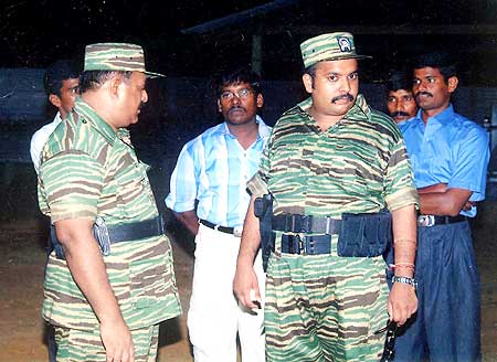 Prabhakaran (left) and his son Charles Anthony (second from right)
