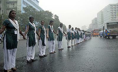 Schoolgirls form a human chain to protest against the conflict in Sri Lanka, in Chennai