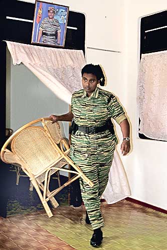 Thamilini provides a chair for visitors at her official residence in Kilinochchi. File picture