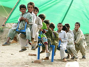 Children displaced by the offensive in Swat Valley play at the Yar Hussain camp in Swabi district