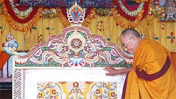 The Dalai Lama arrives on stage to deliver Buddhist teachings at Tawang