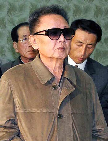 -North Korean leader Kim Jong-il during a visit to a factory