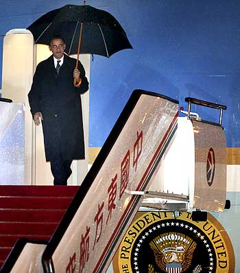 US President Barack Obama steps out of Air Force One at Pudong International Airport in Shanghai