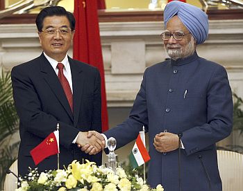 Prime Minister Manmohan Singh greets China's President Hu Jintao.