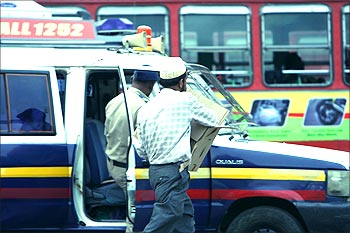 A police Qualis outside the Taj during the attacks.