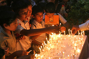 Children lighting candles at the venue