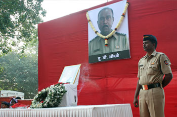 Assistant Sub-Inspector Tukaram Omble's portrait was garlanded at Chowpatty by Mumbai's top cops.