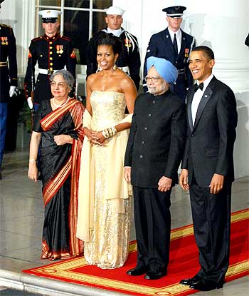 US President Barack Obama and US First Lady Michelle Obama greet Prime Minister Dr Manmohan Singh and his wife Gursharan Singh at the White House State Dinner in Washington, DC