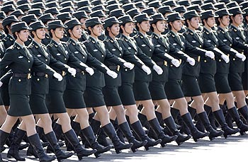 Female soldiers from the Chinese People's Liberation Army march in formation past Tiananmen Square
