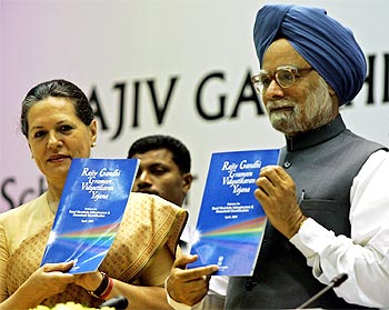Prime Minister Manmohan Singh and Congress President Sonia Gandhi launch an electricity scheme.