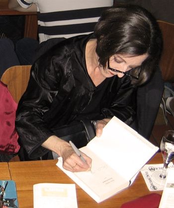 Herta Muller signing her new book Atemschaukel in a German book store