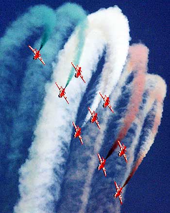 Suryakiran jet trainers perform during the Indian Air Force Day celebrations