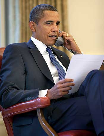 President Barack Obama on a phone call at the Oval Office