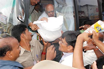 The CM gives out relief material to flood victims