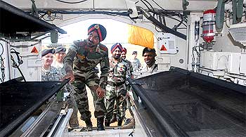 An Indian Army officer explores the inside of a Stryker vehicle