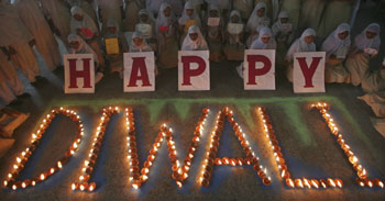 Muslim schoolgirls pose during celebrations to mark Diwali at a school in Ahmedabad