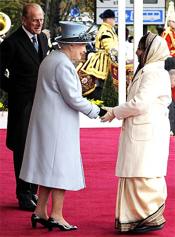 Britain's Queen Elizabeth greets President Pratibha Patil as Prince Philip watches in Windsor Castle