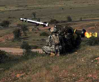 Under the instruction of a US soldier, an Indian Army soldier fires a Javelin missile as part of Yudh Abhyas