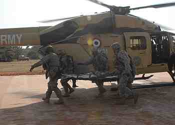 US soldiers and Indian Army soldiers simulate a medical evacuation to an Advanced Light Helicopter of the Indian Army