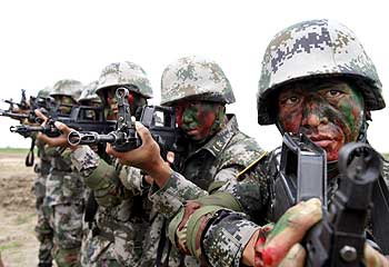 Chinese soldiers prepare for a joint anti-terror exercise with Russia in Taonan, July 14
