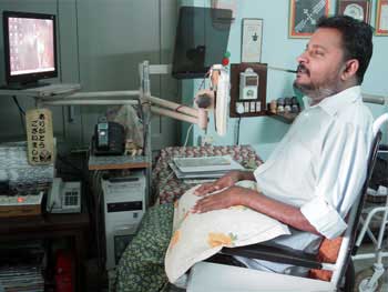 M P Anil Kumar at his desk at the Paraplegic Rehabilitation Centre in Pune