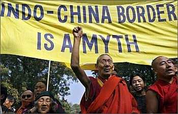 Tibetan exiles shout slogans during a protest against the visit of Chinese Deputy Foreign Minister Dai Bingguo in New Delhi