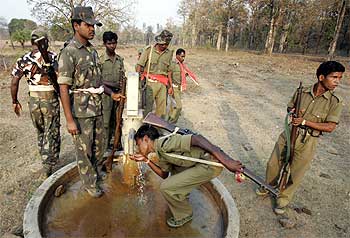 A file picture: Security personnel drink water while patrolling in Maoist territory in Bangapal