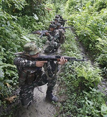 Security forces patrol a Maoist-infested zone