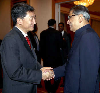 S M Krishna greets his Singapore counterpart George Yeo at the United Nations