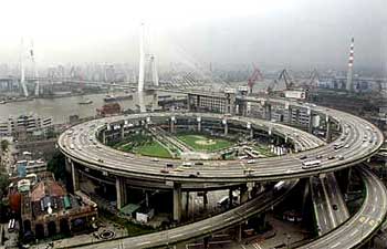 Smog hovers over Nanpu bridge funded by the Asian Development Bank in Shanghai