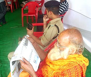 A sadhu catches up on the morning news